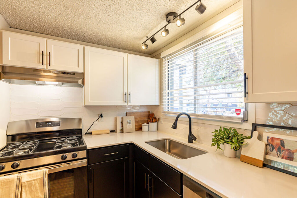 Kitchen with white countertops and stainless appliances