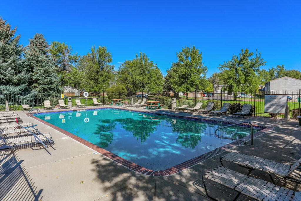 fenced pool with deck seating