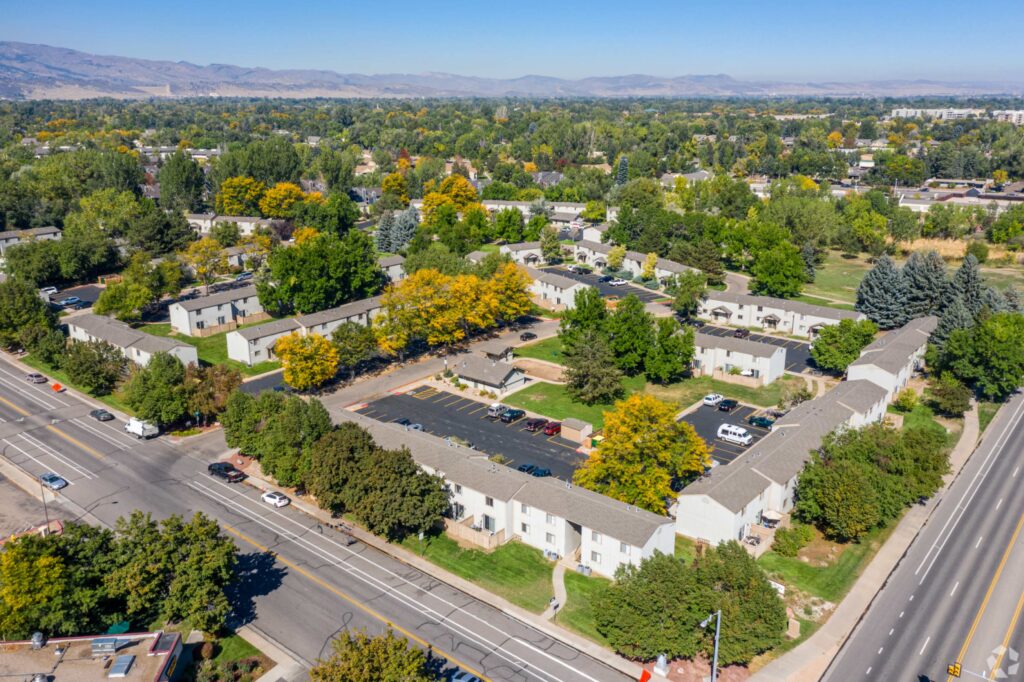 aerial view of the property showing lots of large trees