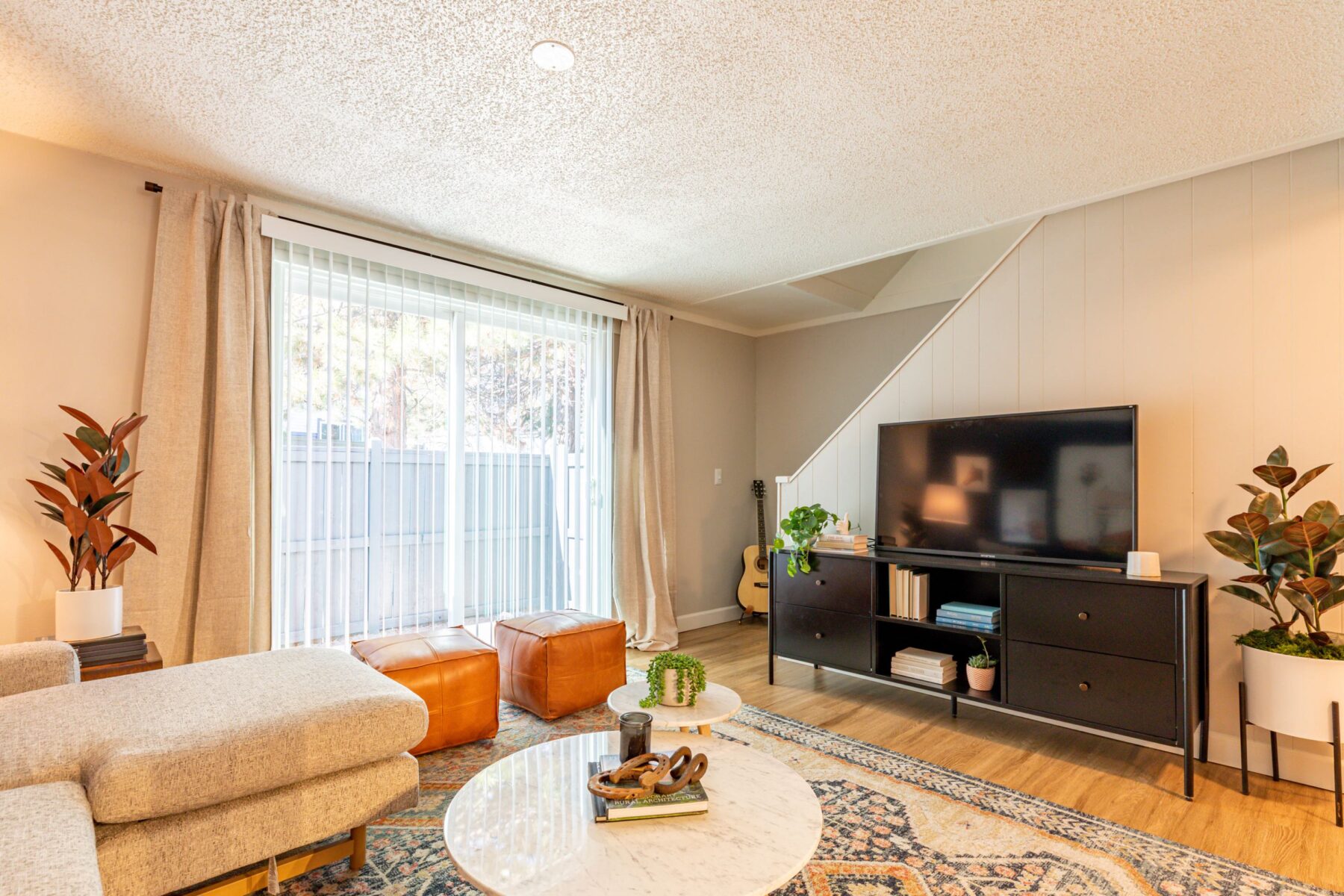 Living Room with Sliding doors and TV stand and a TV