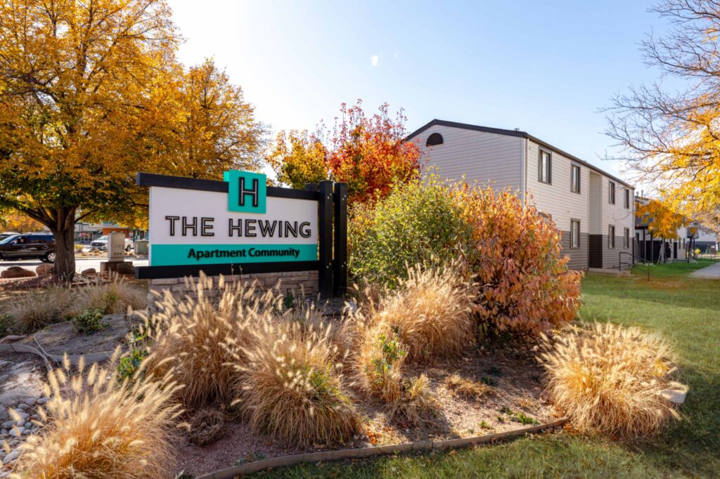 Landscaped sign for the hewing apartment community