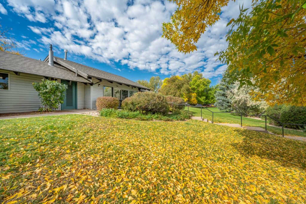 Leasing office exterior surrounded by landscaping